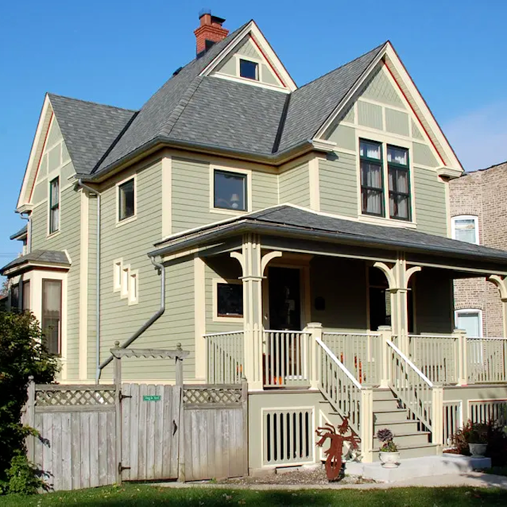 Wood shake siding on a Victorian home requiring yearly maintenance and high-quality exterior paint