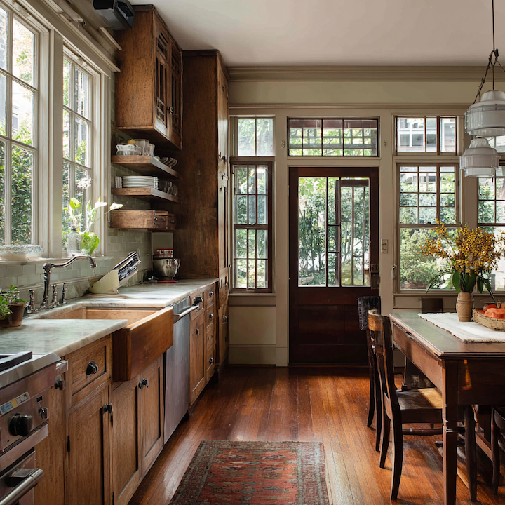 Single-pane drafty windows with original wood frames in an older home with craftsman character